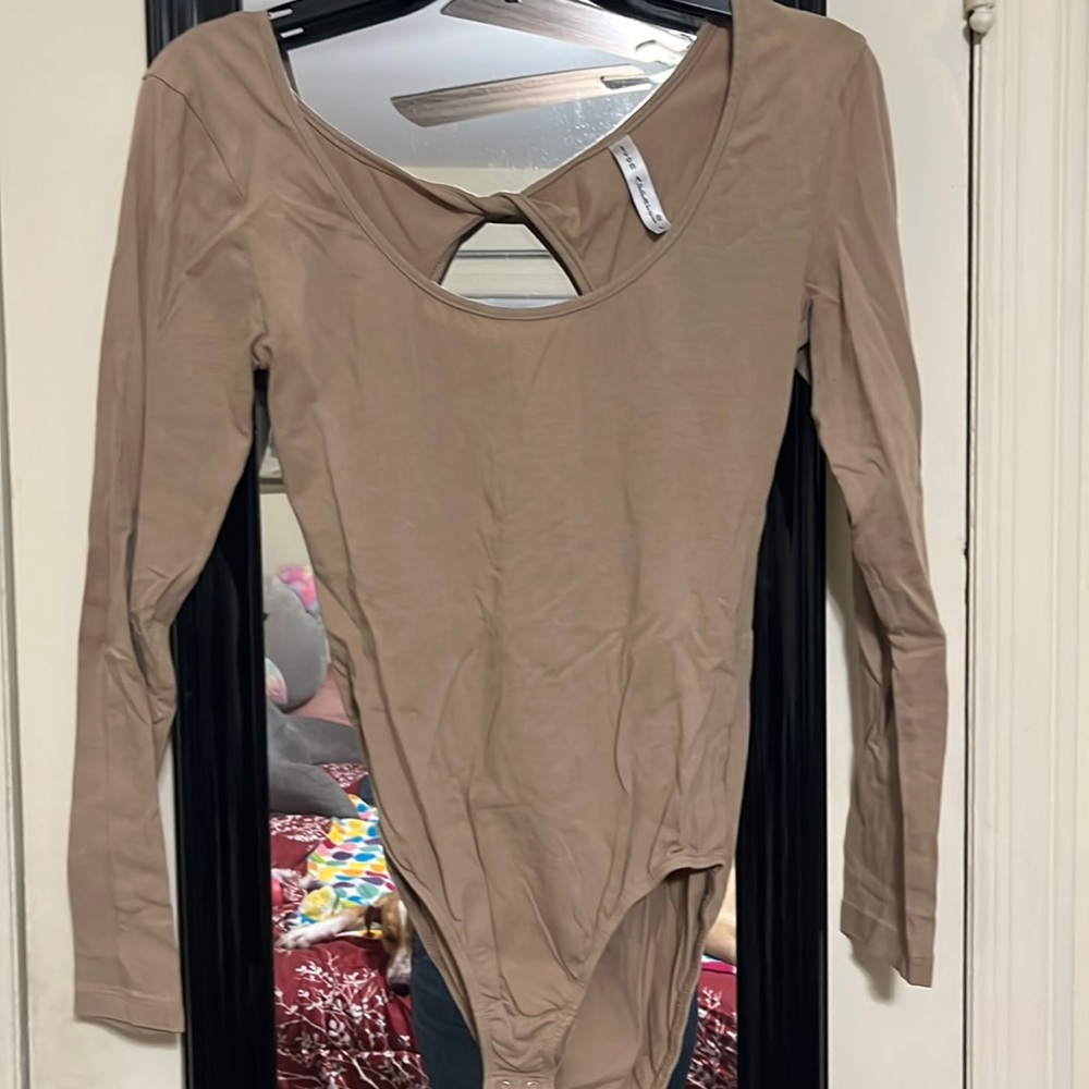 Large tan long sleeve open back bodysuit